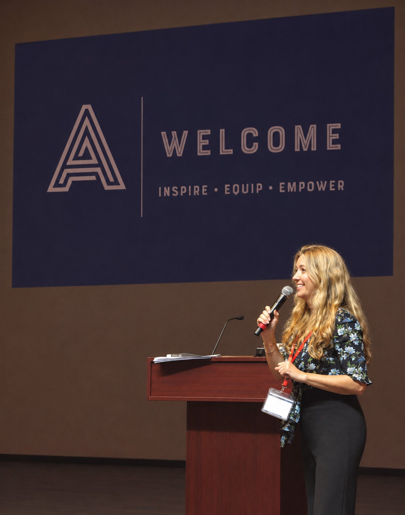 Antonia Ashby welcoming a room with the Articulate Training brand — Inspire, Equip, Empower